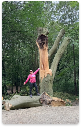 Jodie climing a tree stump